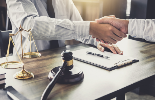 Attorney and his client shake hands